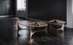 three designs depicted of the oscar coffee table, a table with a metallic build and an Isola-type surface