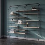 A bookcase with steel frame and wooden shelves.