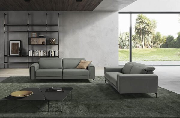 gary is a grey leather sofa with a front foot