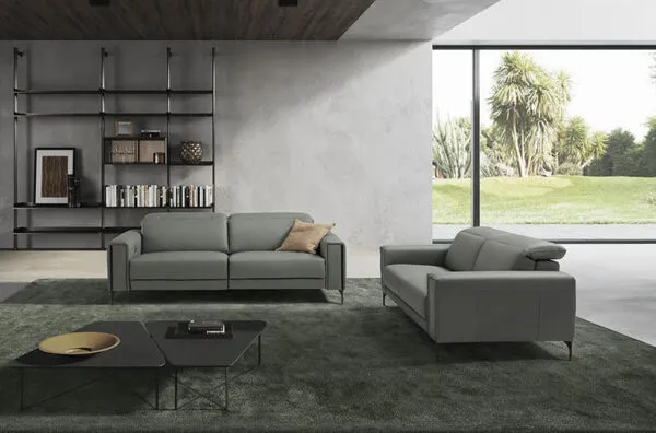 gary is a grey leather sofa with a front foot