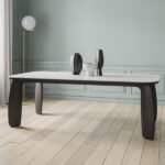 the organic table with solid wooden legs and an Isola-type surface