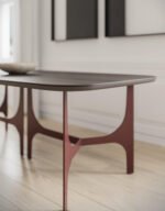 the oscar table with a metallic build and an Isola-type surface